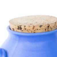 Two Bright Blue Ceramic Canisters with Handles and Cork Tops