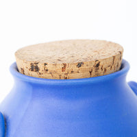 Two Bright Blue Ceramic Canisters with Handles and Cork Tops