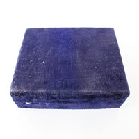 Two matching brass champagne flutes in a blue velvet box