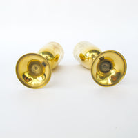 Two matching brass champagne flutes in a blue velvet box