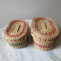 Vintage set of Two Small Intricately Woven Stacking Oval Baskets with Original Lids