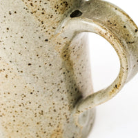 Greyish White Speckled Pottery Ceramic Pitcher with Rust Tones
