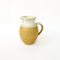 Ceramic Pitcher with Golden Tone Finishes