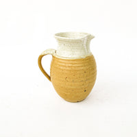 Ceramic Pitcher with Golden Tone Finishes