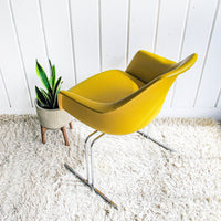 Midcentury Burke Action Chair from The Vector Group out of Texas