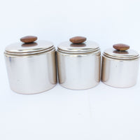 Set of 3 Rose Gold Mirro Canisters with Wood Tops and some surface wear