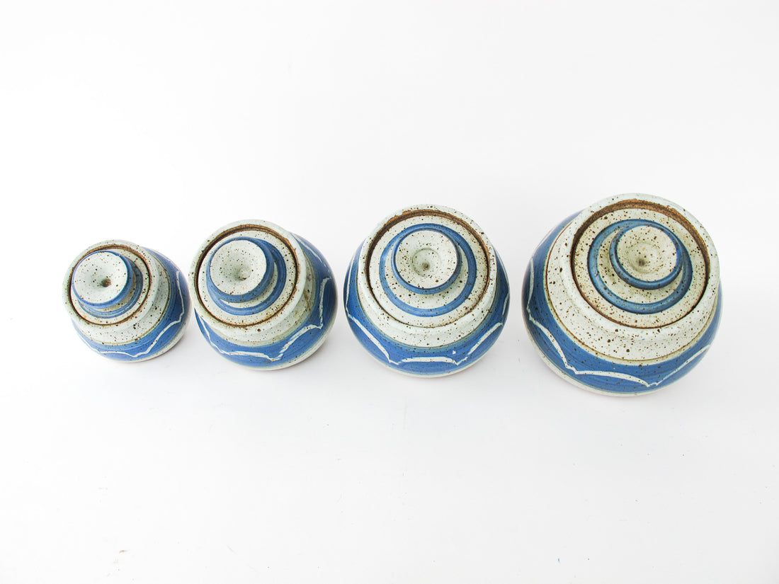 Set of 4 Hand Spun Leaning Ceramic Canisters with Button Top Lids and Blue Wave Design