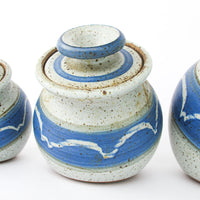 Set of 4 Hand Spun Leaning Ceramic Canisters with Button Top Lids and Blue Wave Design