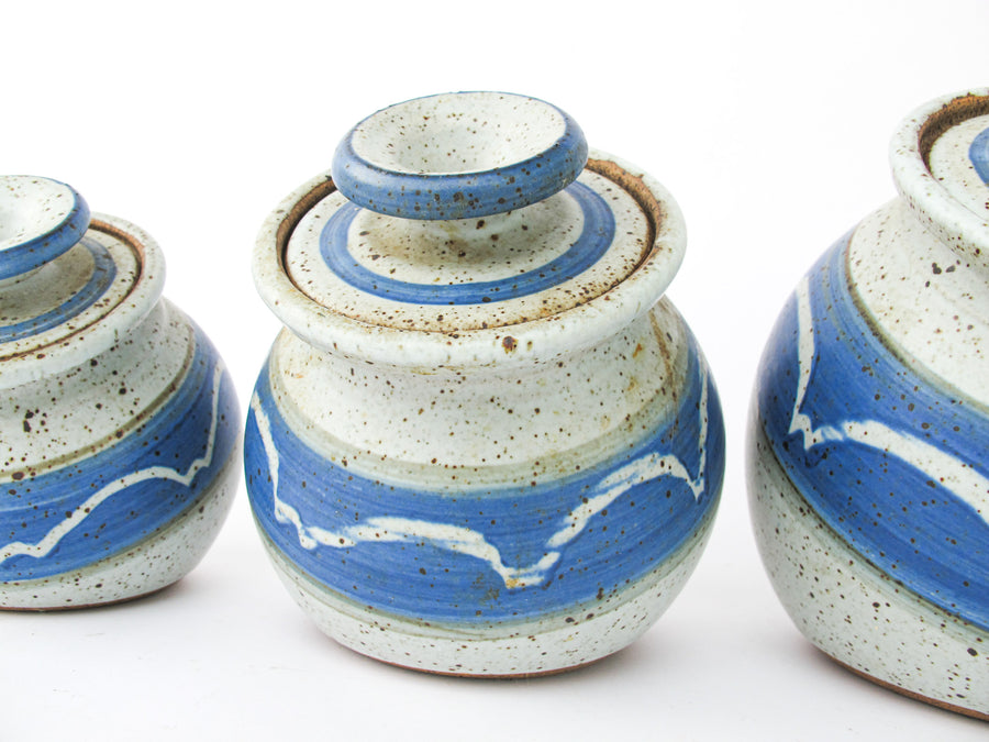 Set of 4 Hand Spun Leaning Ceramic Canisters with Button Top Lids and Blue Wave Design