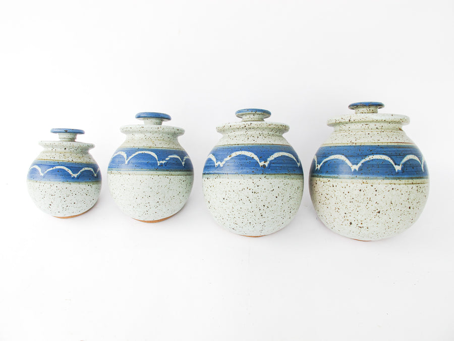 Set of 4 Hand Spun Leaning Ceramic Canisters with Button Top Lids and Blue Wave Design