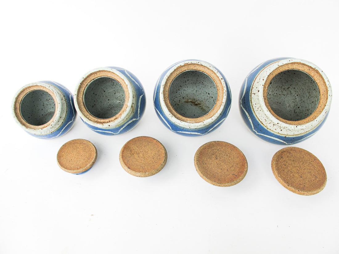 Set of 4 Hand Spun Leaning Ceramic Canisters with Button Top Lids and Blue Wave Design