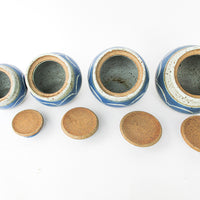 Set of 4 Hand Spun Leaning Ceramic Canisters with Button Top Lids and Blue Wave Design