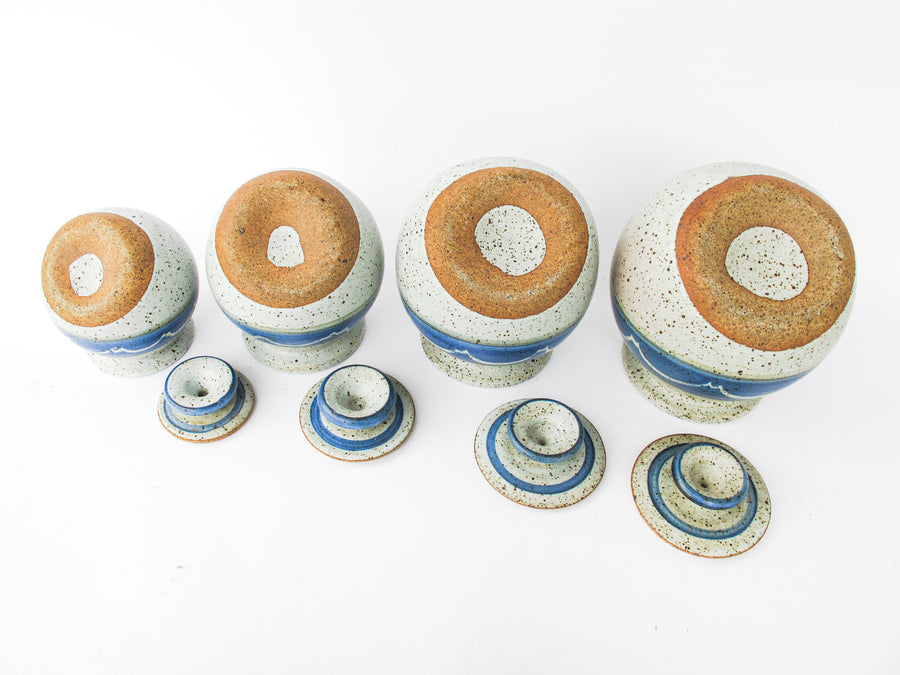 Set of 4 Hand Spun Leaning Ceramic Canisters with Button Top Lids and Blue Wave Design