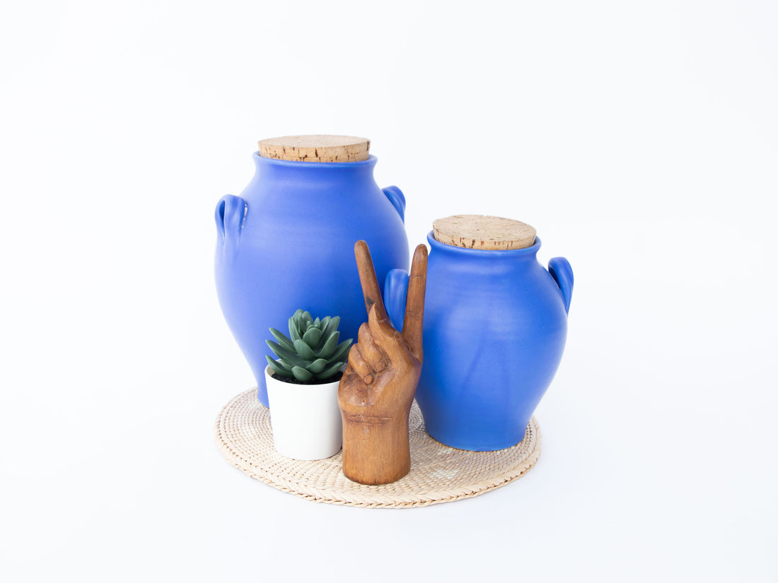 Two Bright Blue Ceramic Canisters with Handles and Cork Tops
