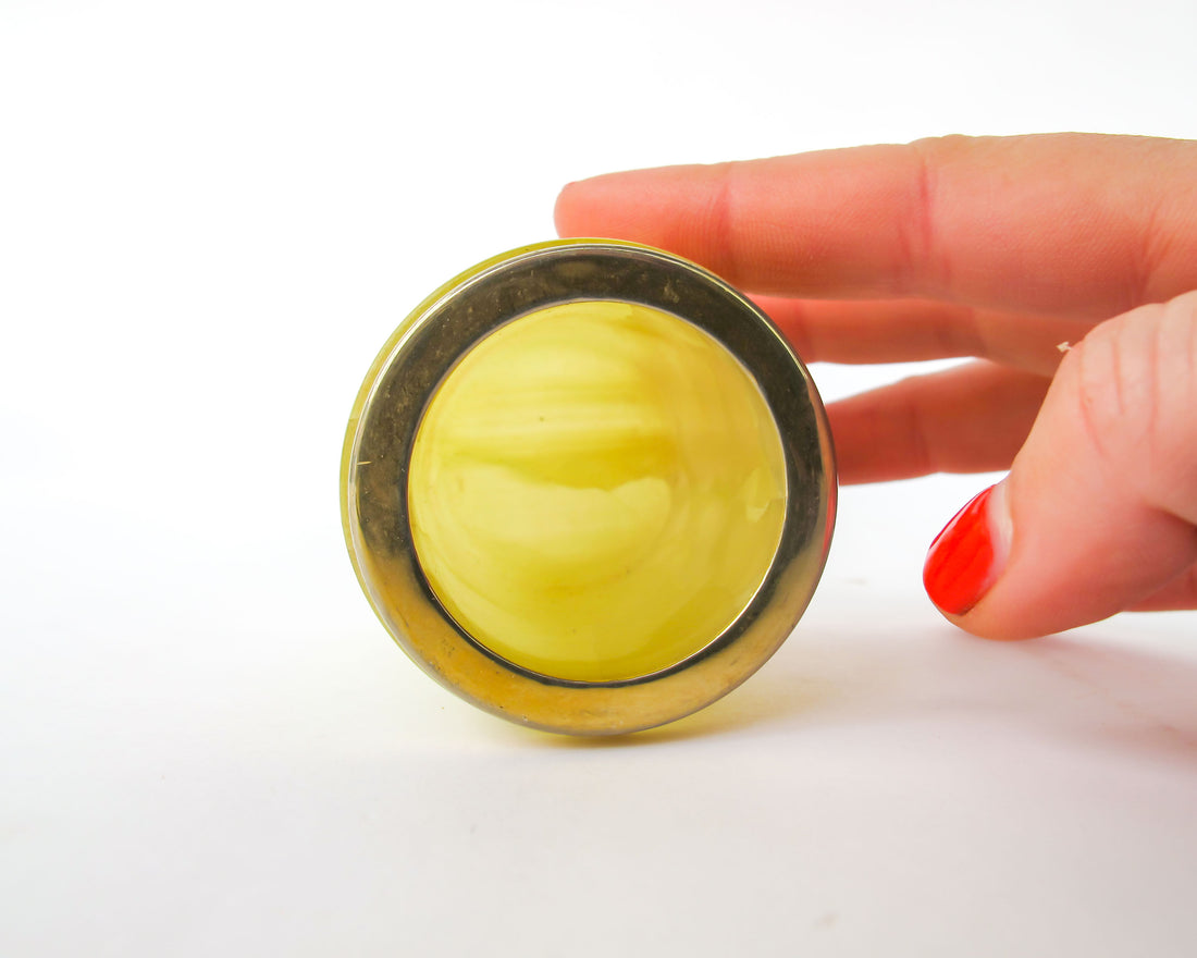 Small Yellow marble jar with brass rim