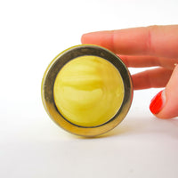 Small Yellow marble jar with brass rim