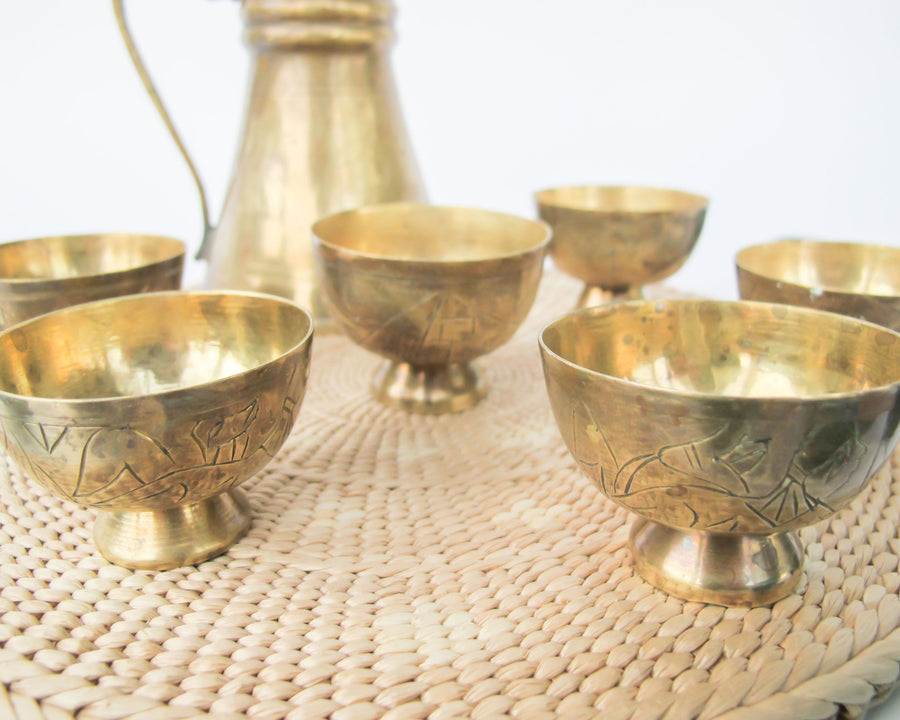 Set of 6 brass mini cups with blue glass inserts and 1 brass tea pot