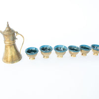 Set of 6 brass mini cups with blue glass inserts and 1 brass tea pot