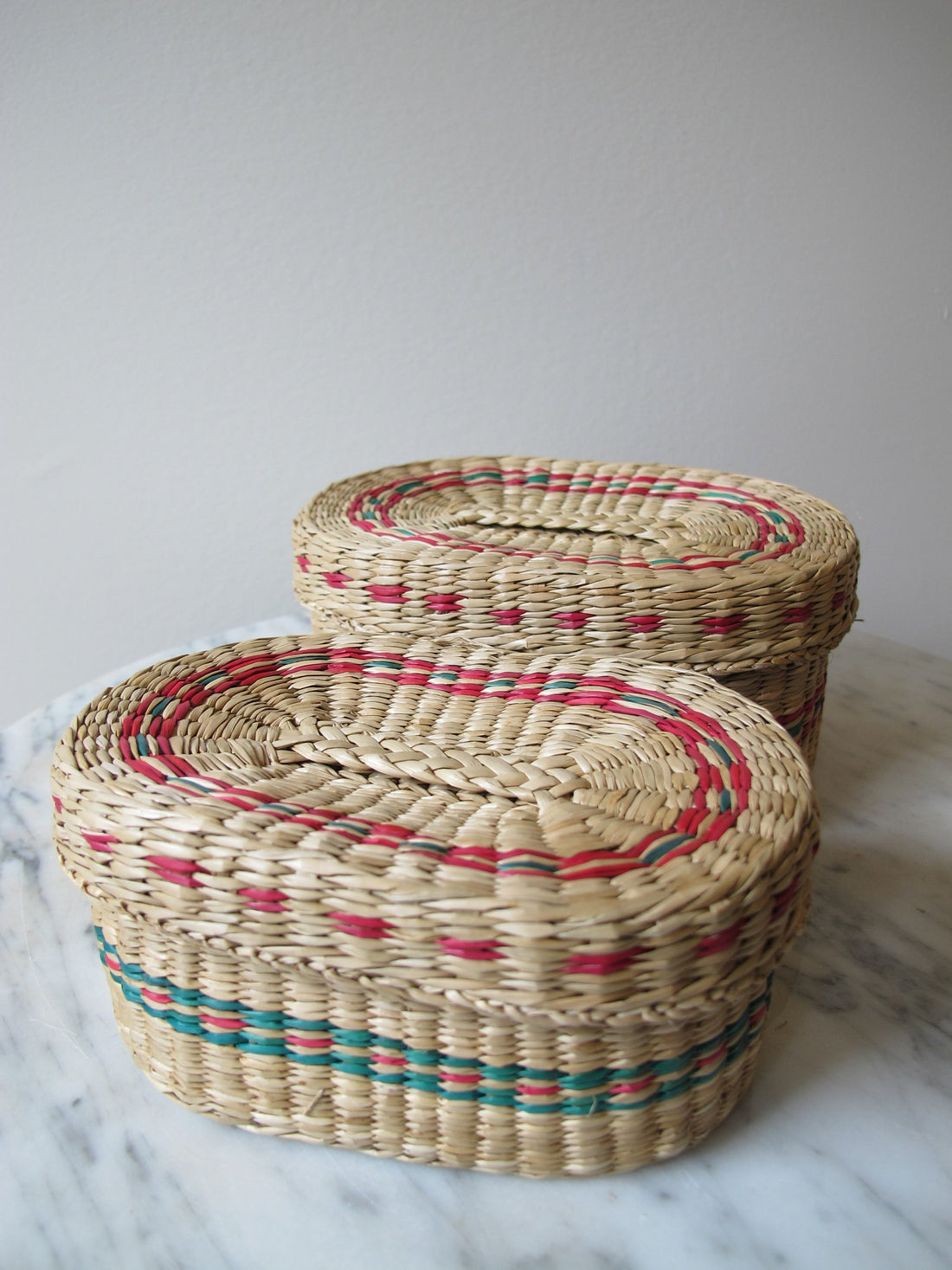 Vintage set of Two Small Intricately Woven  Stacking Oval Baskets with Original Lids